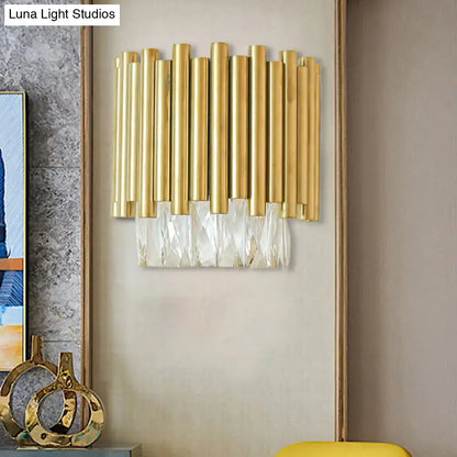 Modernist gold-toned wall light with brass vertical rods and cascading clear faceted crystal fringe for living room