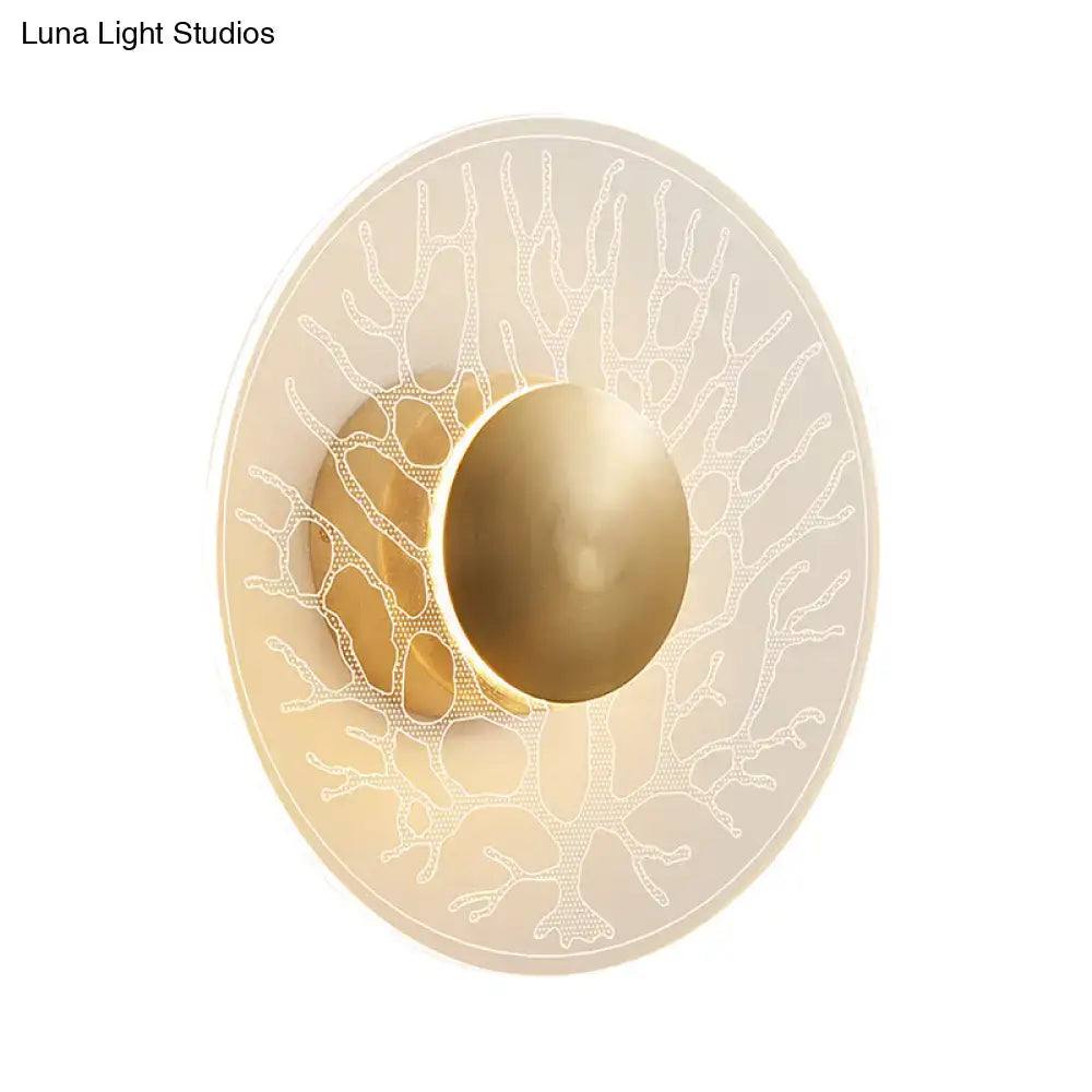 Elegant oval modern style brass light fixture with clear frosted glass diffuser and etched coral patterns for living room