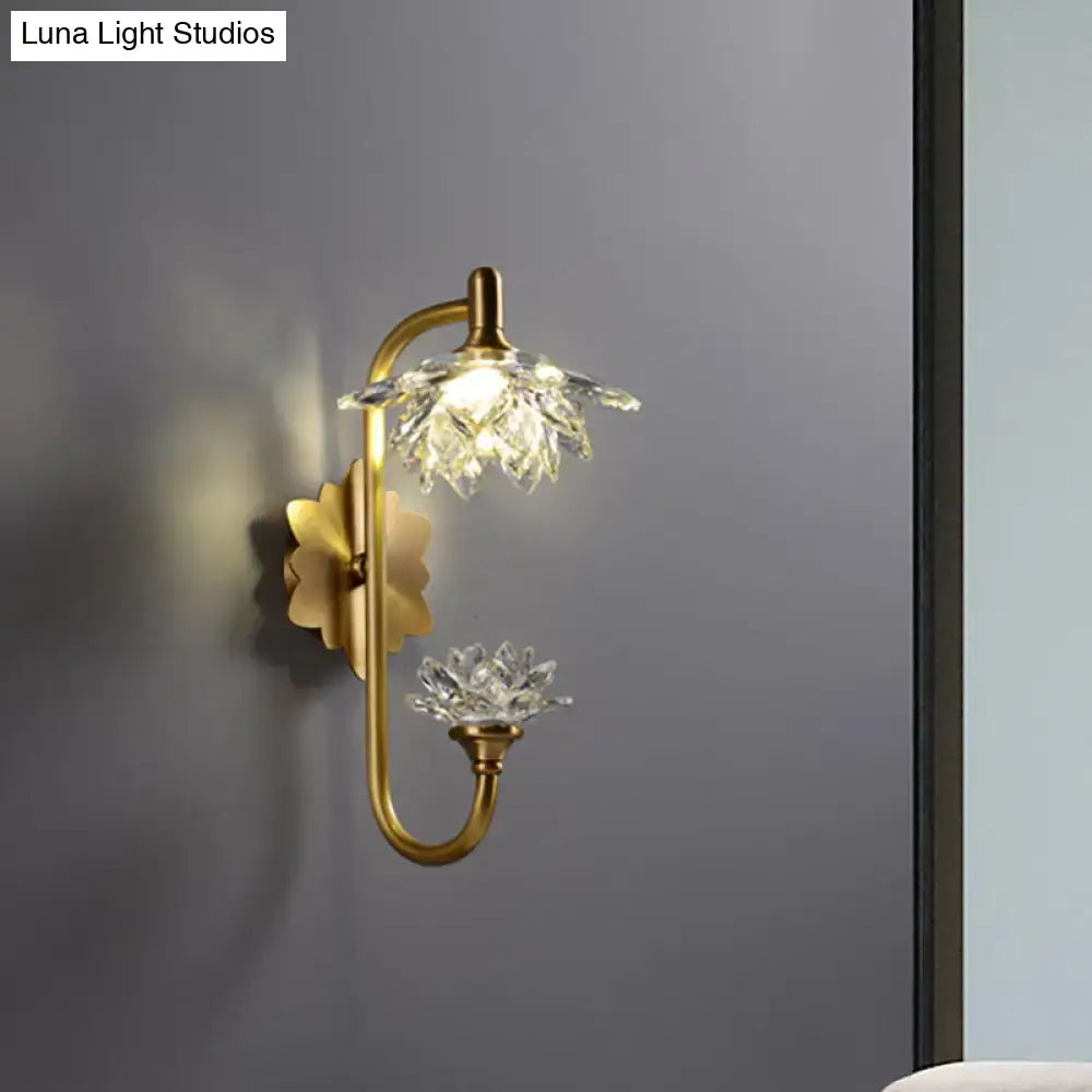 Modernist wall sconce with brass finish curved arm and crystal flower shade for bedroom lotus light decor