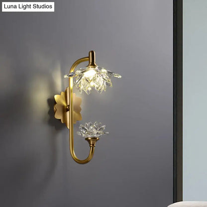 Modernist wall sconce with brass finish curved arm and crystal flower shade for bedroom lotus light decor