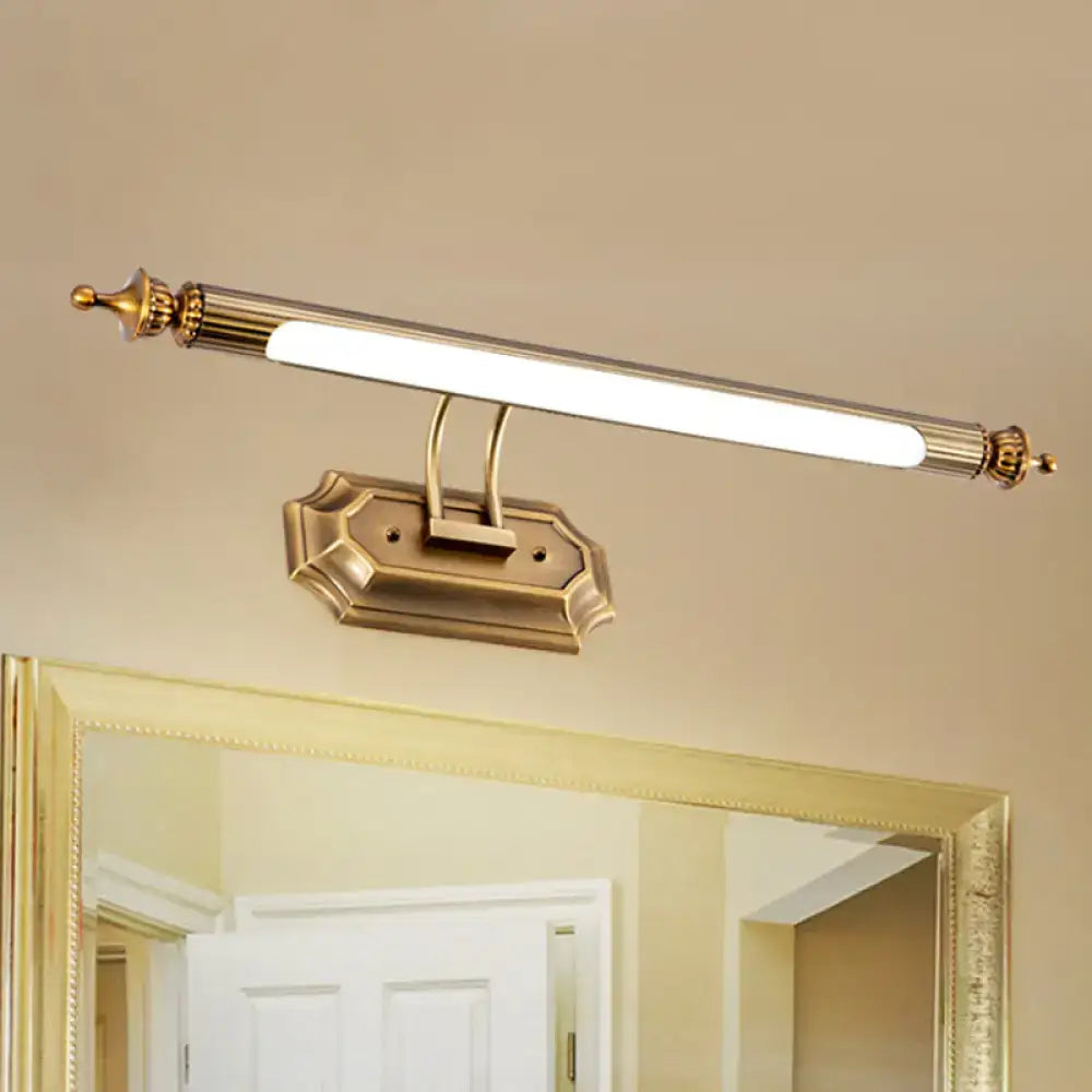 Gold-finished led vanity light fixture with sleek elongated design and ornate decorative ends for bathroom use