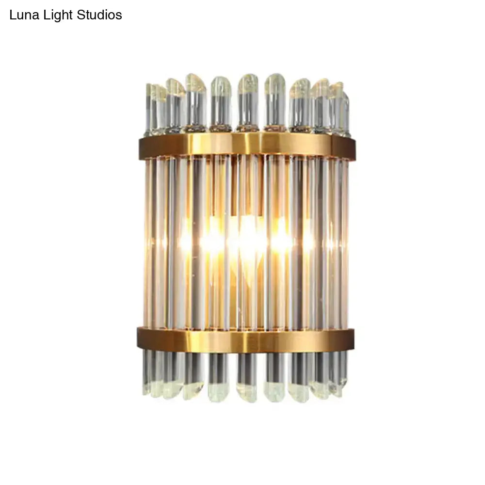 Gold finish modernist wall sconce with vertical glass rods and clear crystal accents for living room lighting