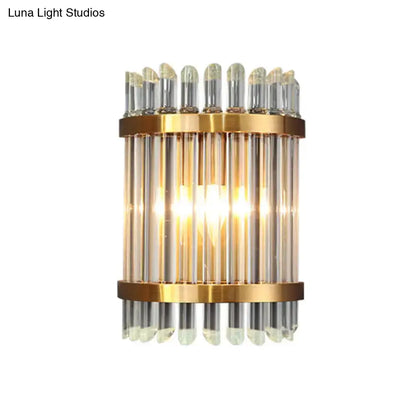 Gold finish modernist wall sconce with vertical glass rods and clear crystal accents for living room lighting
