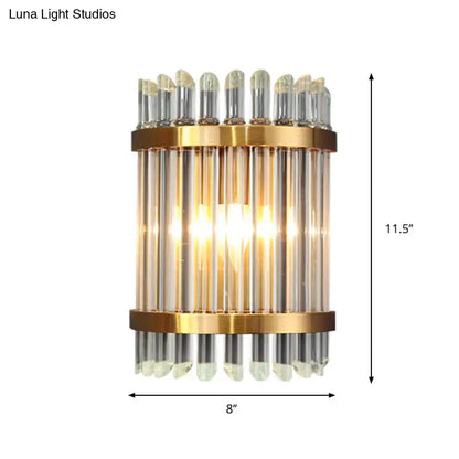 Modernist gold finish wall sconce with vertical glass tubes and clear crystal accents for living room lighting