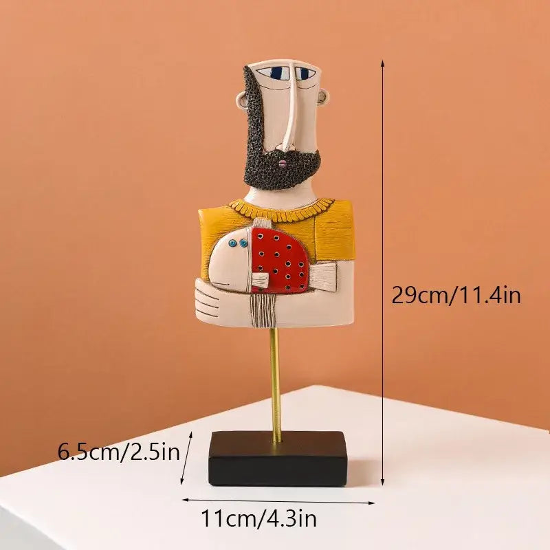 Abstract ceramic people statue figure of a bearded man in yellow sweater holding a red polka-dotted fish for modern decorbites abstract people collection