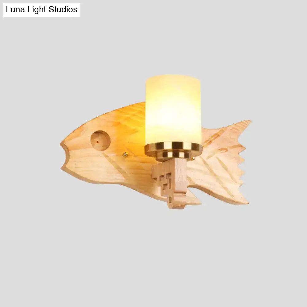 Modernist fish wood backplate wall sconce with warm tones cracked glass shade and brass accents for bedroom lighting