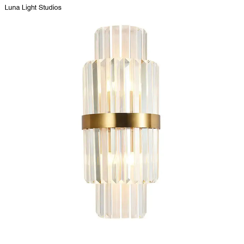 Modernist gold and clear crystal cylinder wall lighting with stacked faceted crystal rods and polished metal band