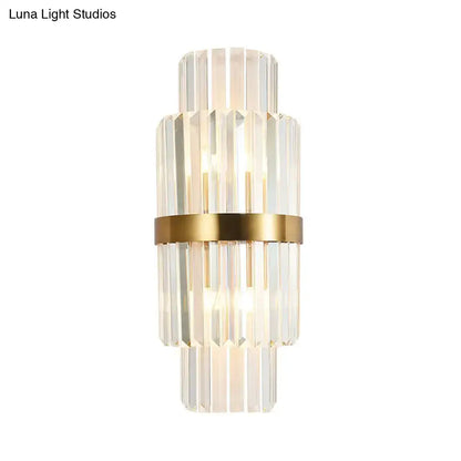 Modernist gold and clear crystal cylinder wall lighting with stacked faceted crystal rods and polished metal band