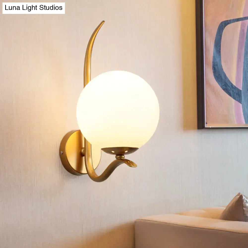 Modernist gold sconce light with white frosted glass globe and curved metal arms for bedroom 220v-240v