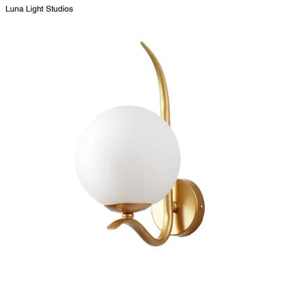 Modernist gold-toned sconce light with smooth opaque white glass shade for bedroom 220v-240v use