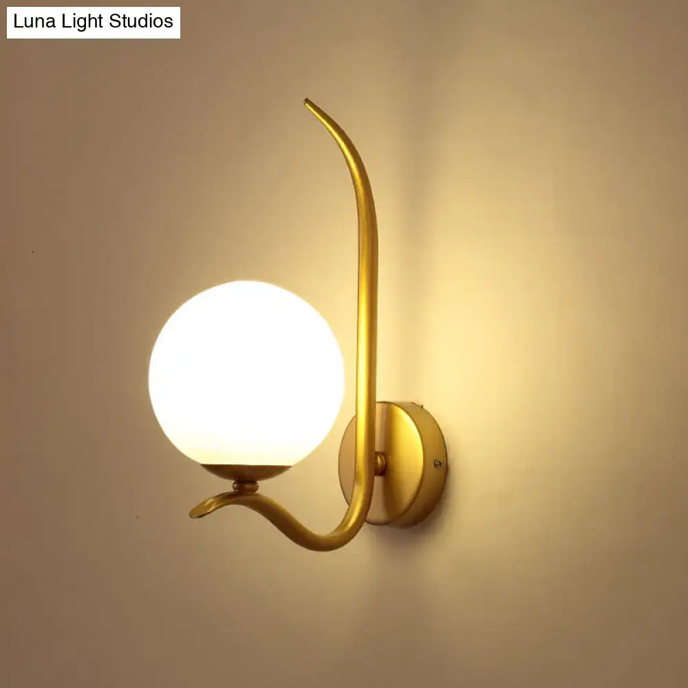 Modernist gold sconce light with curved arm and white frosted glass globe ideal for bedroom 220v-240v