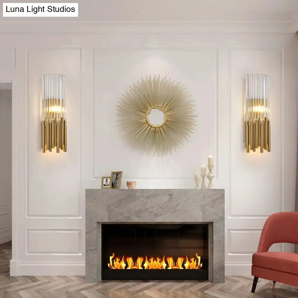 Modernist gold sunburst wall light fixture with a central circular frame and radiating spiky rays for bedroom use