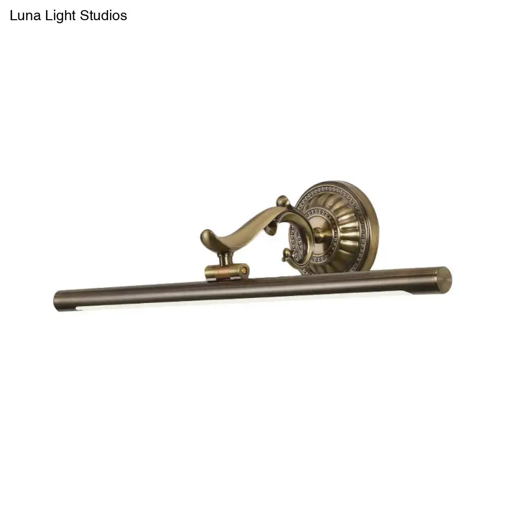 Modernist gold linear metallic vanity wall light with antique brass finish and ornate circular wall light backplate