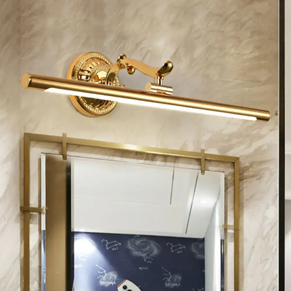 Modernist gold linear metallic vanity wall light with a sleek elongated bar and ornate circular base for bathroom use