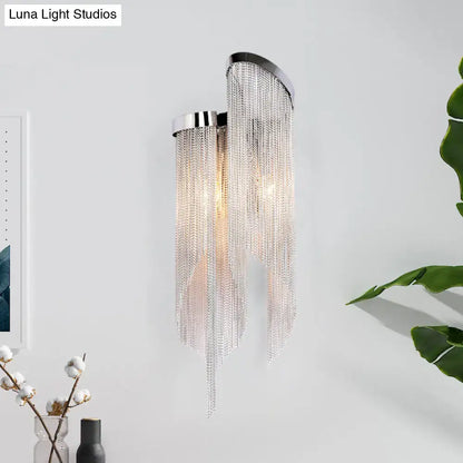 Modernist aluminum tassel wall sconce with sleek chrome finish and clear crystal chains for living room lighting