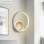 Modernist gray and wood ring wall sconce with sleek outer ring and warm wood accent ideal for bedroom led lighting