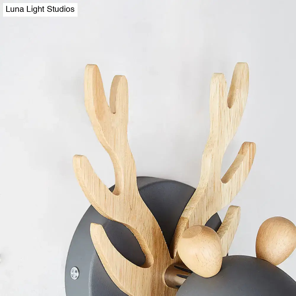 Modernist green and wood antler cylinder shape sconce with natural wood ears on matte black base for 110v-120v use