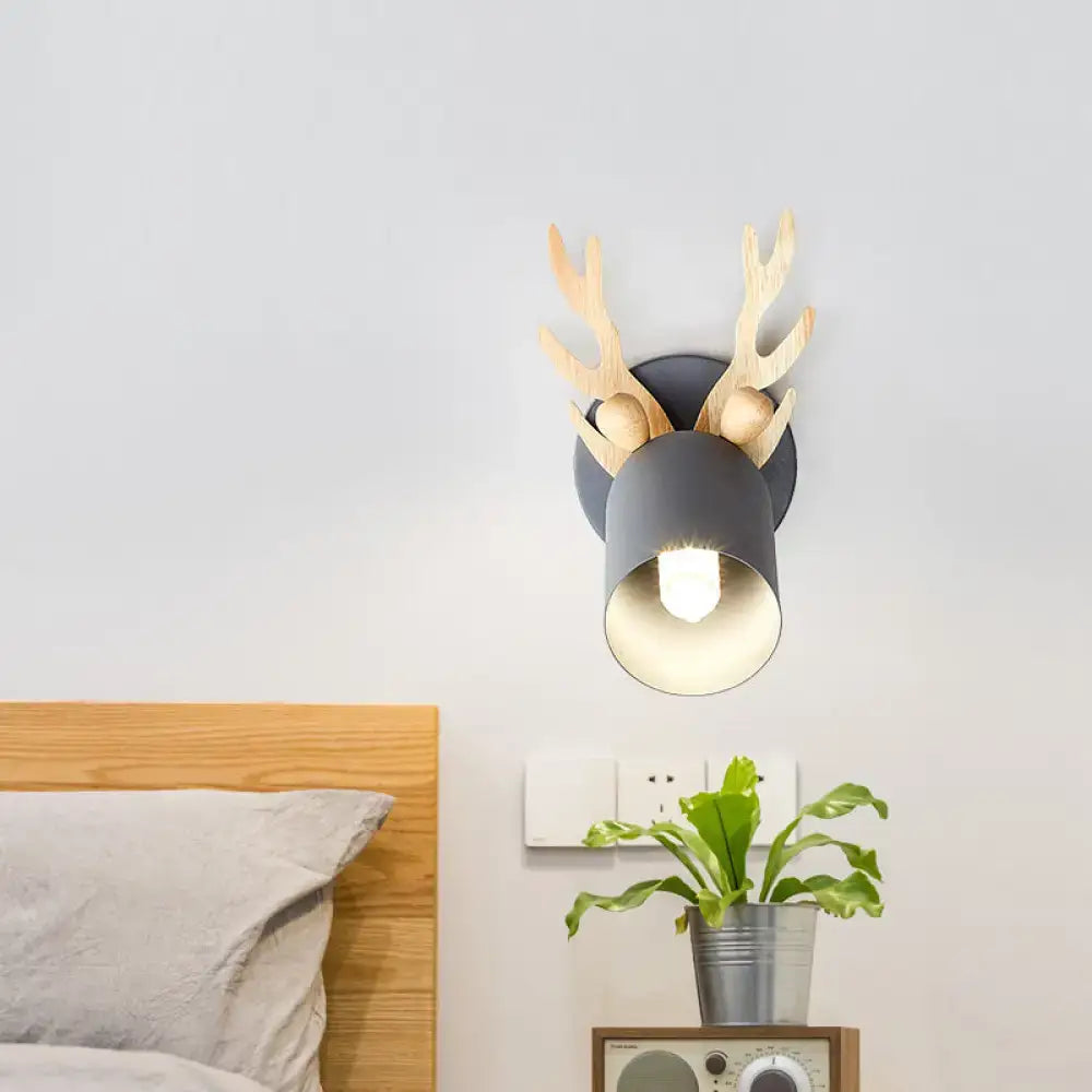 Gray metal wall sconce with light-colored wooden antlers in cylinder shape suitable for 110v-120v and 220v-240v use