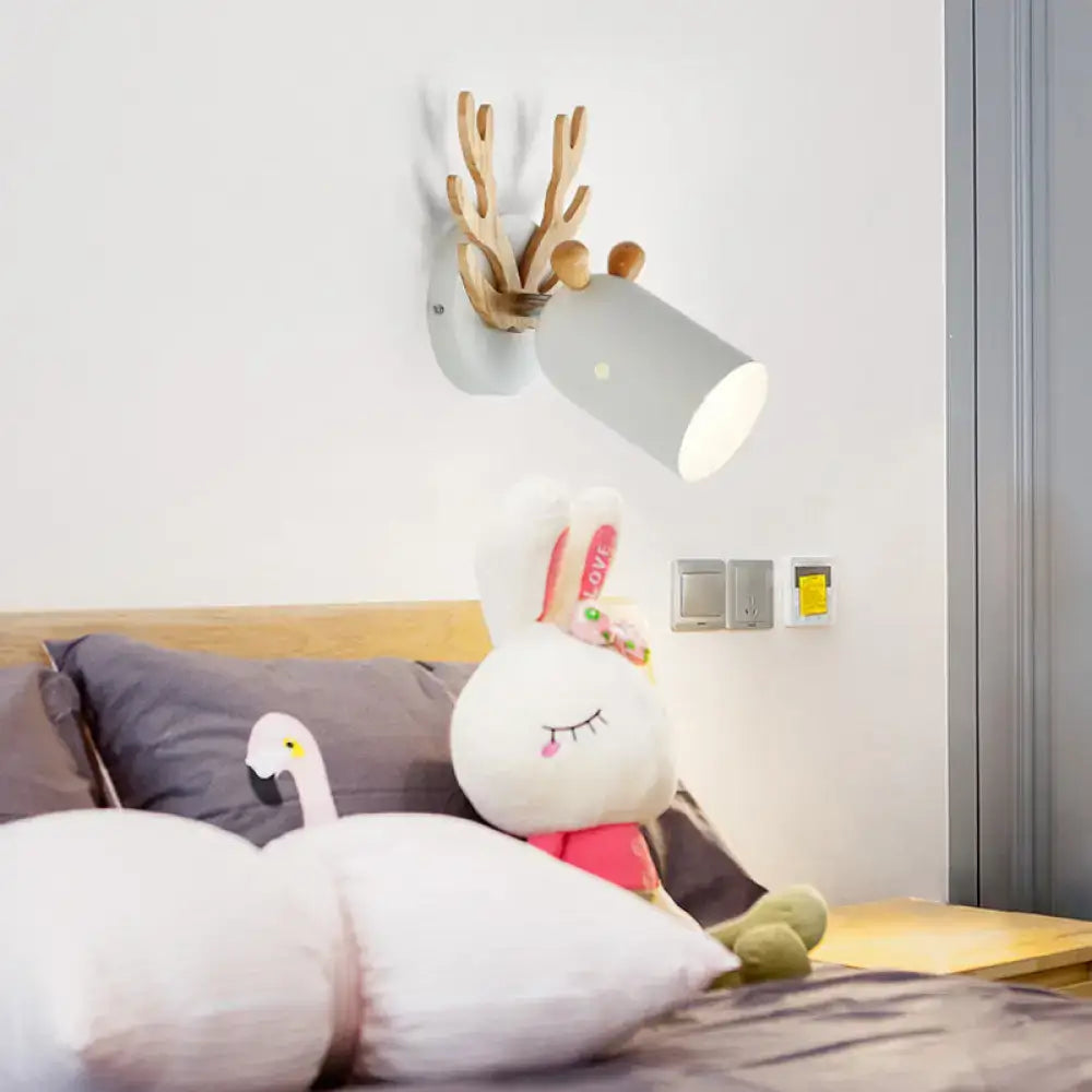A modernist gray wall-mounted cylinder shape sconce with wooden deer antler design for 220v-240v and 110v-120v use