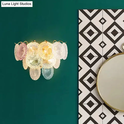 Modernist pink and blue layered disc wall light with pastel translucent glass and gold accents for dining room use
