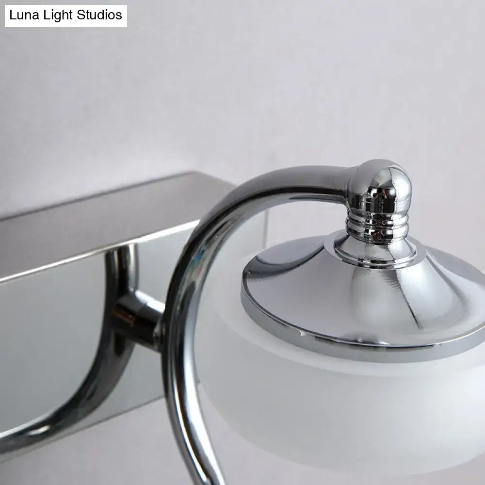 Modernist silver bathroom vanity light with chrome finish, frosted acrylic shades, and elegant curved arm wall lamp