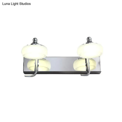 Modernist silver bathroom vanity light with frosted acrylic globe shades and chrome wall lamp featuring integrated hooks