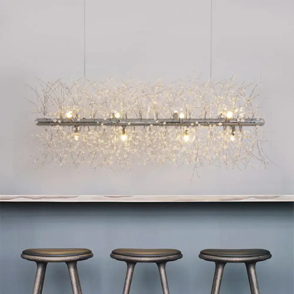 DecorBites modernist silver pendant light with metallic frame and crystal bead deco strands emitting warm glow