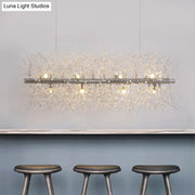 Decorbites modernist metallic branch island pendant light in silver with crystal bead deco strands emitting warm light