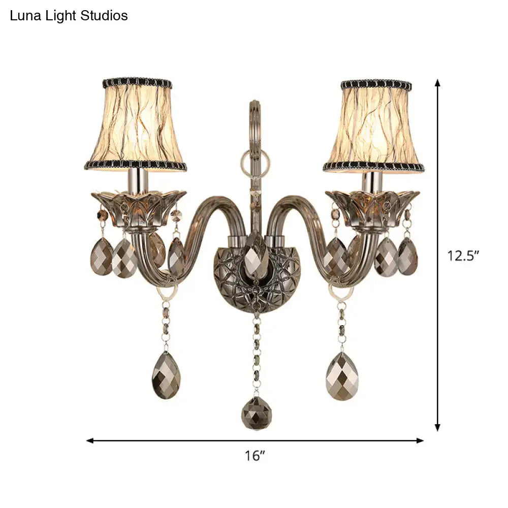 Antique bronze two-light wall sconce with faceted crystal droplets smoke grey living room wall mounted lighting