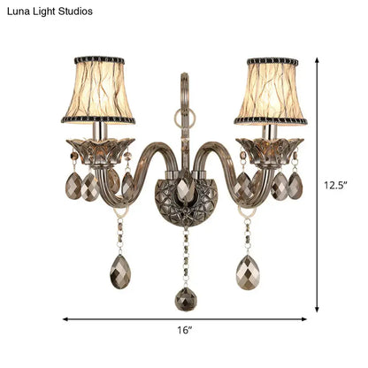 Antique bronze two-light wall sconce with faceted crystal droplets smoke grey living room wall mounted lighting