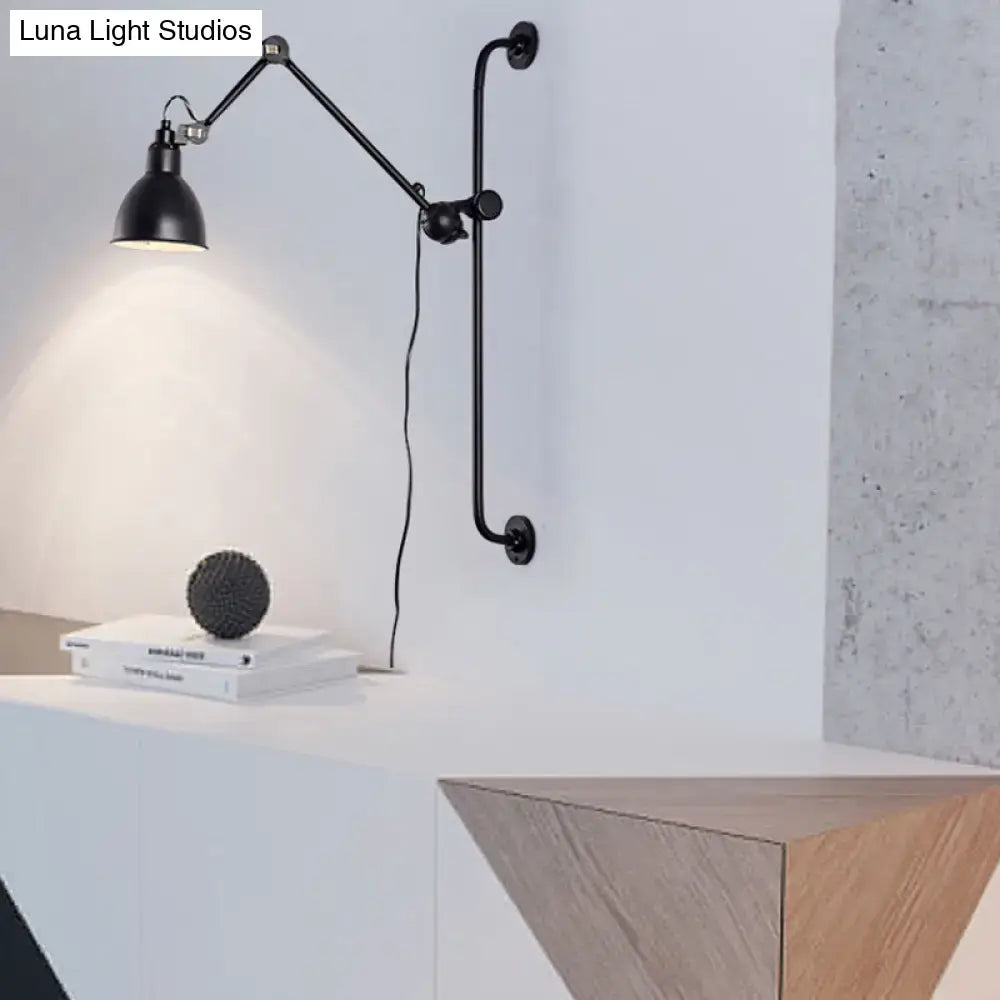 Black articulated wall light with matte finish and adjustable arm in modernist style for dining room use