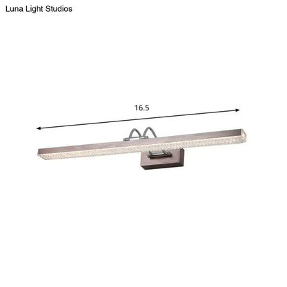 Modernist wall light featuring a brushed nickel LED vanity light with textured glass panel and sleek rectangular design