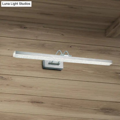 Silver rectangular modernist wall light with textured frosted glass diffuser and metal bracket for bedroom vanity use