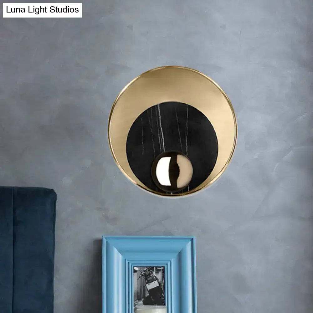 Modern gold-toned led sconce lighting with round marble black insert for white black bedroom wall mirror