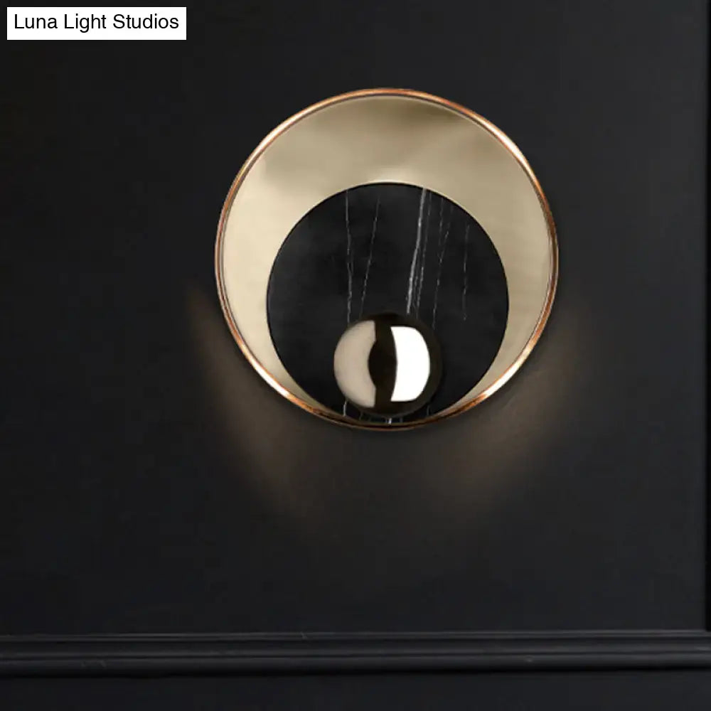 Modernist white black led sconce lighting with a polished brass ring and round marble disc for bedroom wall mirror