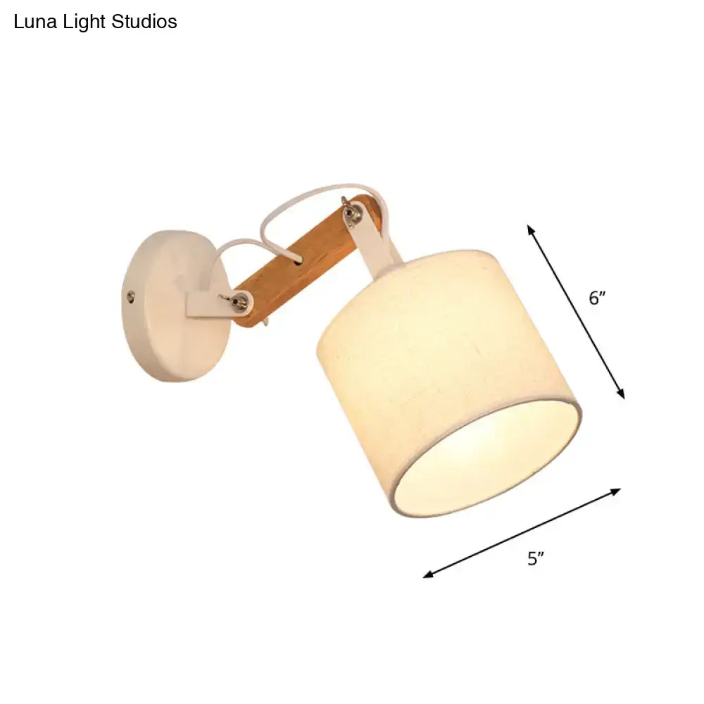 Cream-colored cylindrical fabric wall lamp with adjustable wood arm and white mounting plate for 220v-240v 110v-120v use