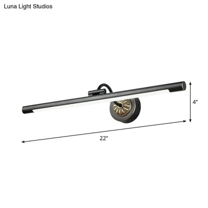 Black modern led wall lamp with brass-finished circular base and cylindrical body designed as vanity mirror light with max wattage