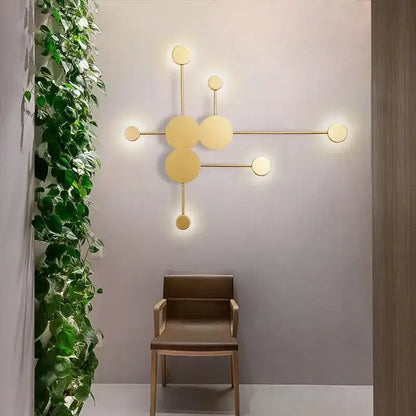 Modern gold-toned wall lamp with geometric interconnected circles from decorbites creative line rgb for living room decor