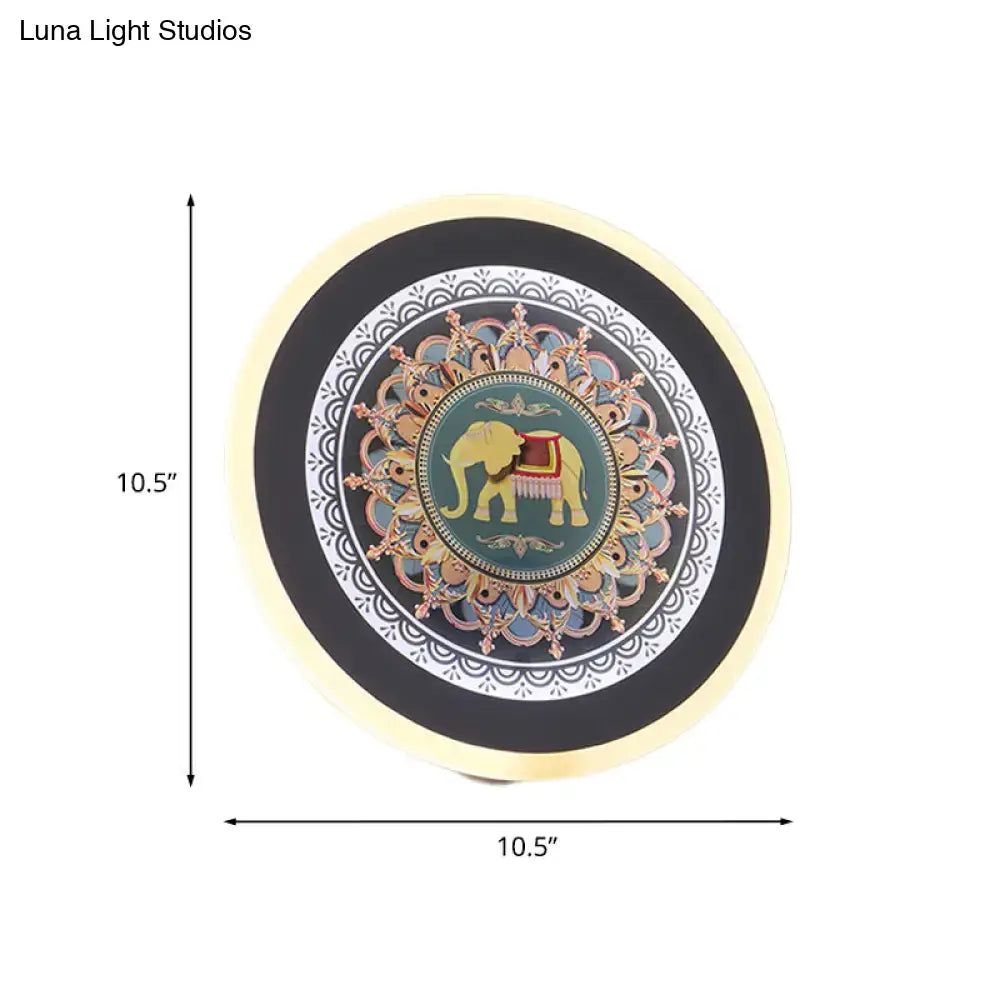 Moroccan elephant wall mural led lamp featuring a circular teal plate with a golden elephant and intricate mandala patterns