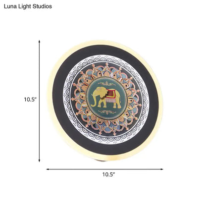 Moroccan elephant wall mural led lamp featuring a circular teal plate with a golden elephant and intricate mandala patterns