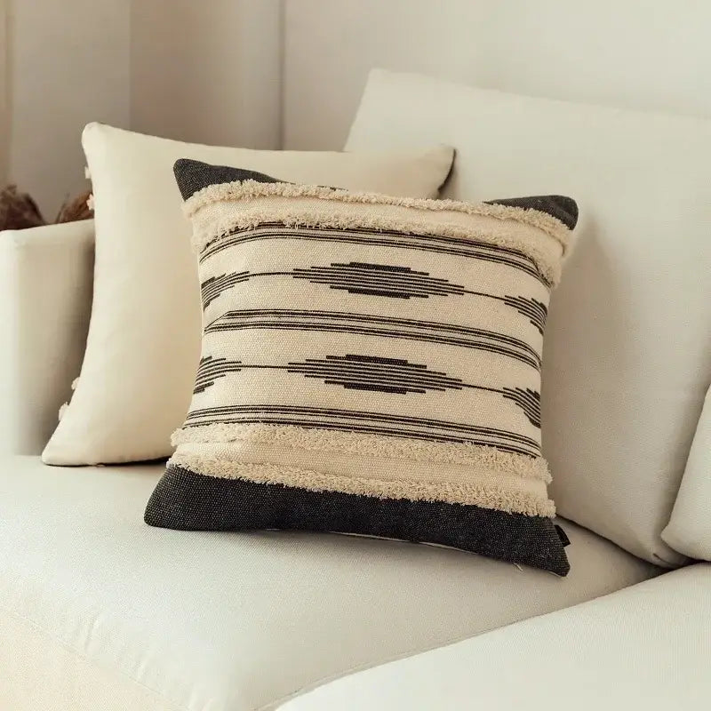 Beige and black woven cushion cover with geometric patterns and frayed edges from Moroccan geometric cover set