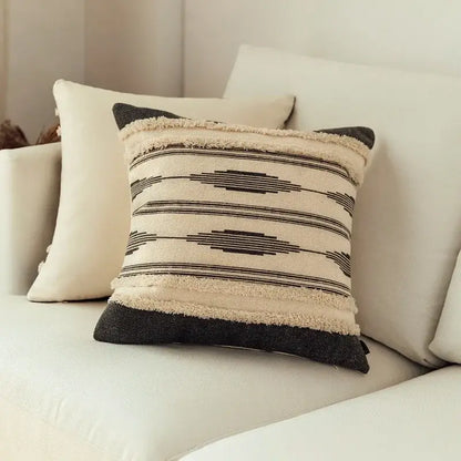 Beige and black woven cushion cover with geometric patterns and frayed edges from Moroccan geometric cover set