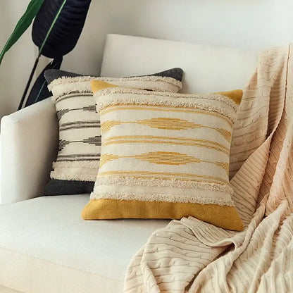 Cream-colored cushion cover set with mustard-yellow geometric stripes and textured woven fabric for living room