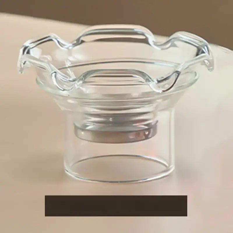 Clear glass candle holder with scalloped rim and cylindrical base from mountain base glass tea cup set with wood handle