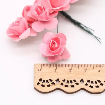 Pink paper roses with delicate layered petals and green wire stems from decorbites 144pcs 2cm artificial paper set