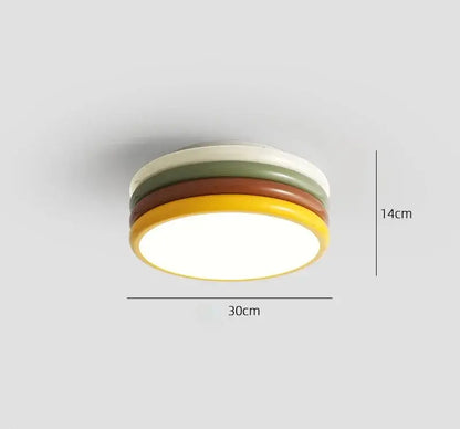 Multi color stack ceiling lamp with rounded cream, olive green, terracotta, and mustard yellow rings by decorbites