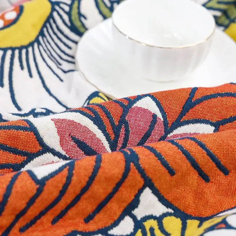 Multicolor gauze flower bath towel with vibrant orange red floral design navy blue outlines and textured weave decorbites gauze flower