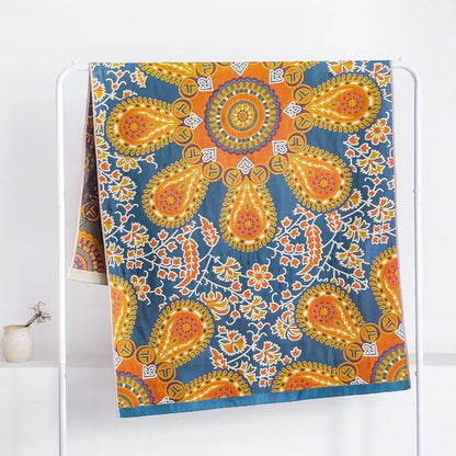 Vibrant orange and teal paisley decorbites gauze flower bath towel with intricate floral details for bedroom decor