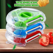 Clear plastic case holding a multicolor magic peeler trio set with green blue and red blades for kitchen slicing