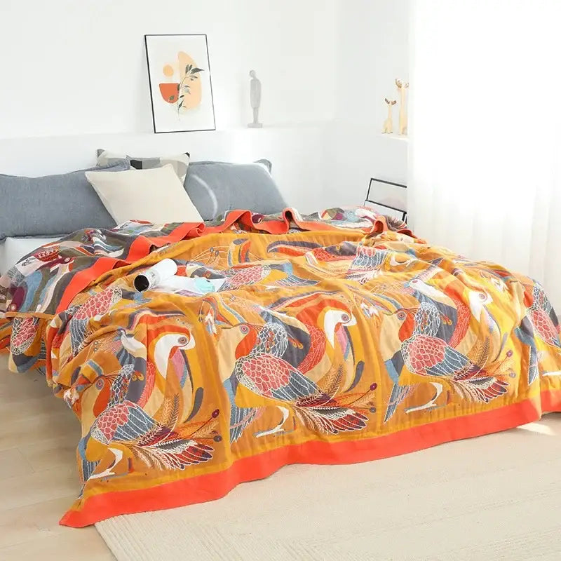 Vibrant orange and red bird-patterned decorbites cotton gauze boho throw blanket with soft textured fabric for living room
